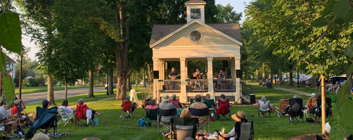 people enjoying a gazebo concert